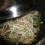 Chow mein style roasting of bean sprout in a covered pan Image