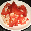 Vinegared dish of tomato and deep-fried batter balls Image