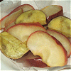 A dish simmered in syrup of an apple and the sweet potato Image